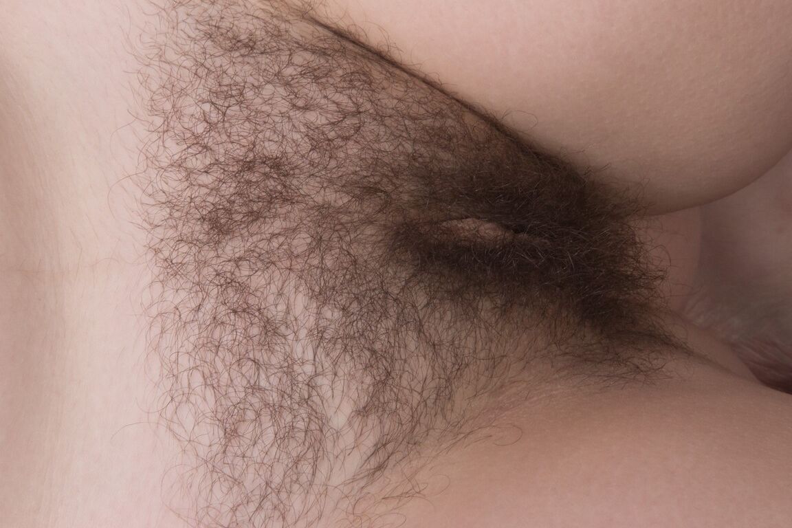 21P Short haired amateur Dmitri Vosche displays her bushy crotch and small breasts