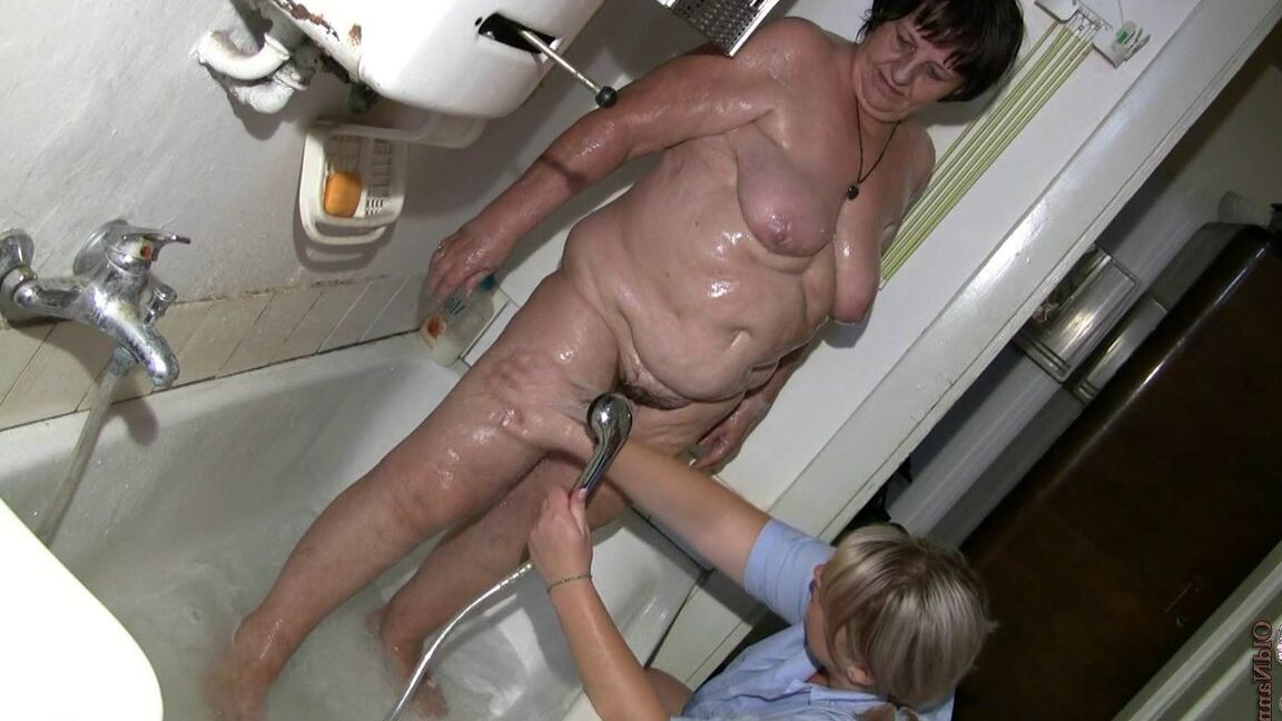 21P Chubby granny Gisela gets her twat rubbed while getting bathed by nurse Kata