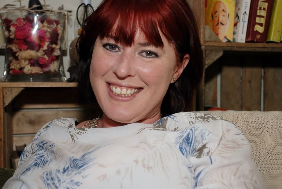 20P Redhead amateur BBW smokes while sliding cutoff shorts aside on a couch