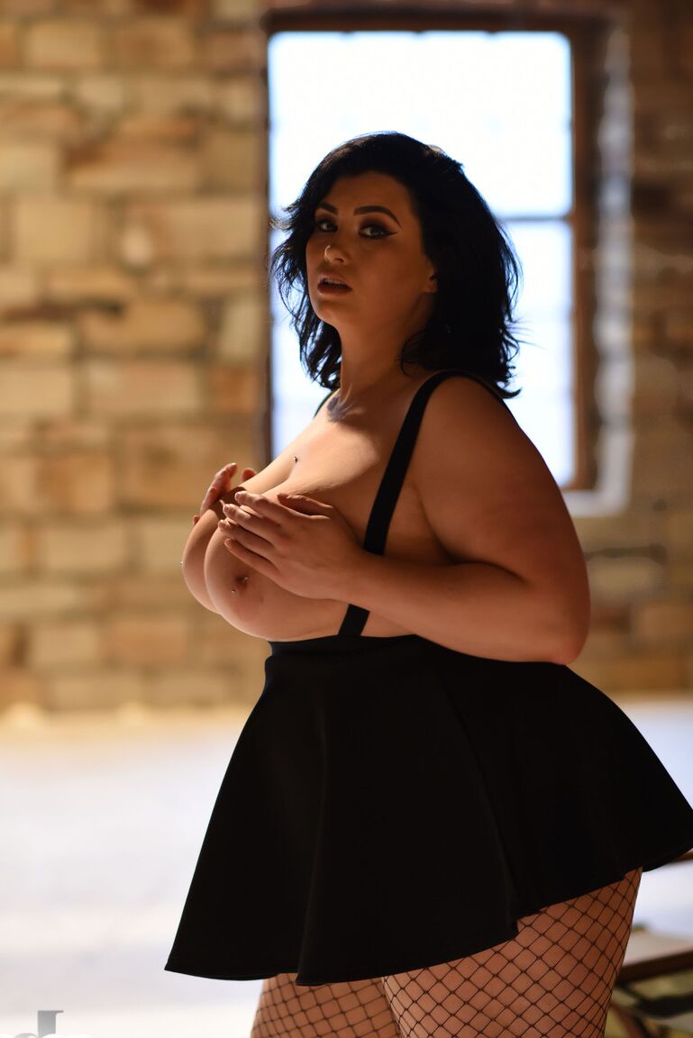 21P Chubby gorgeous lady Kiki lets out her massive juggs wearing a short skirt