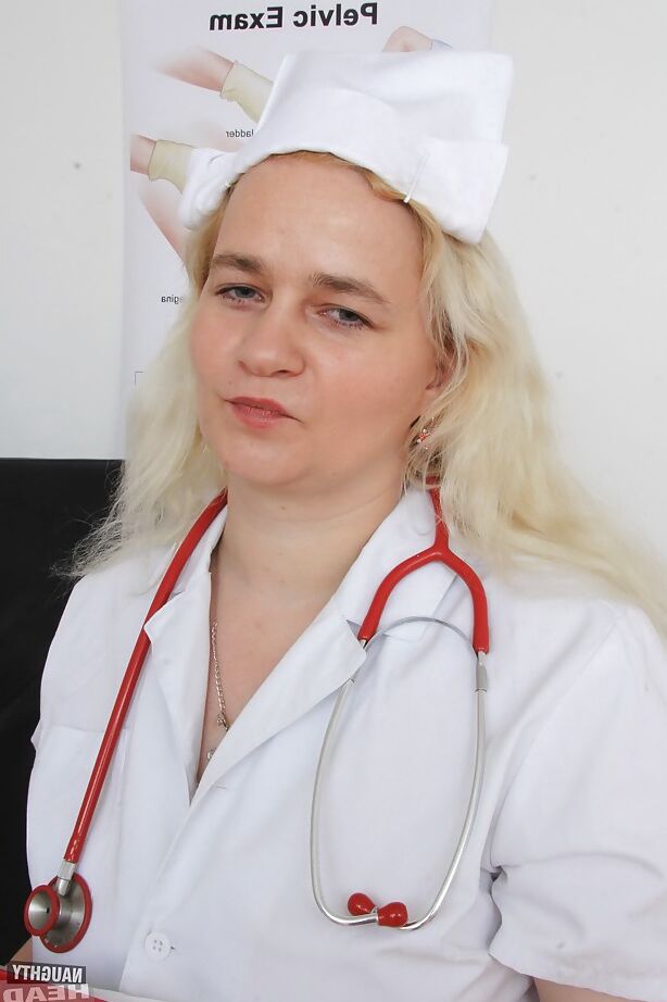 16P Older blonde nurse Elena stripping off nurse's uniform in examination room