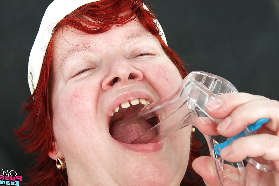 16P Chubby redhead granny masturbating her unshaven cunt in gyno office