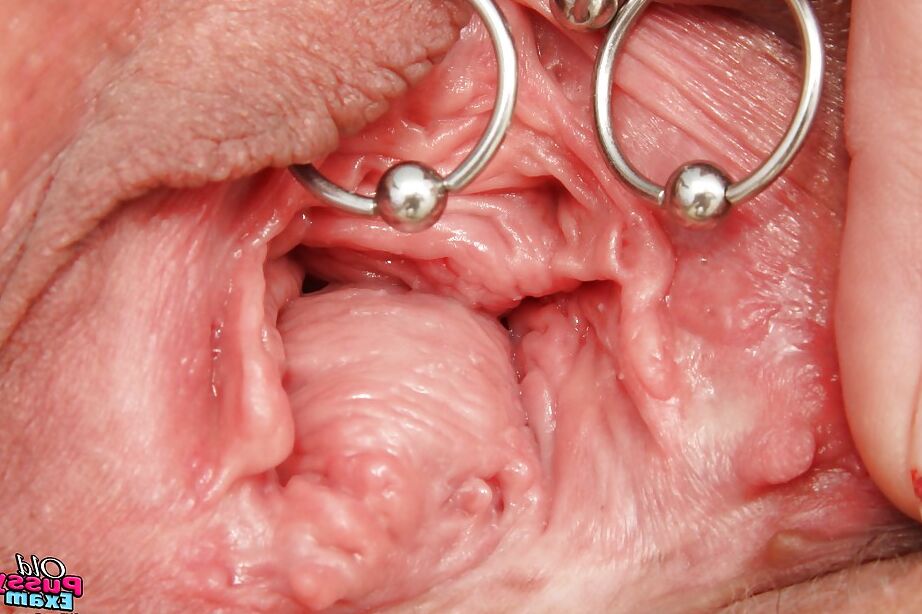 16P Mature lady in glasses taking off her panties and exposing her pierced cunt