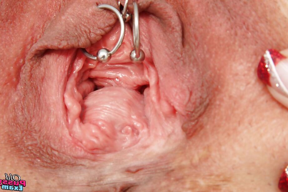 16P Mature lady in glasses taking off her panties and exposing her pierced cunt