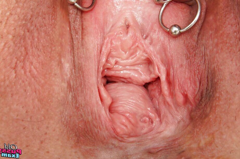 16P Mature lady in glasses taking off her panties and exposing her pierced cunt