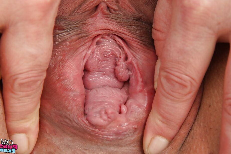 16P Chubby mature lady in nurse uniform uncovering her jugs and shaved twat