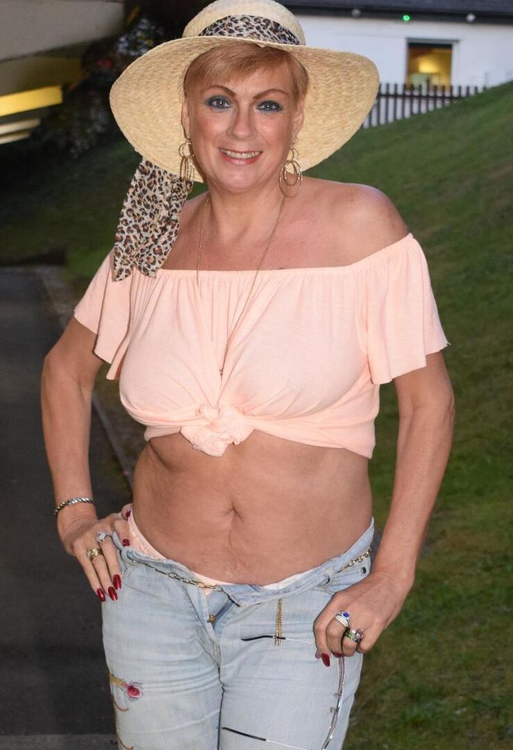 16P Mature lady Dimonty strips off her clothes in a backyard while wearing shades