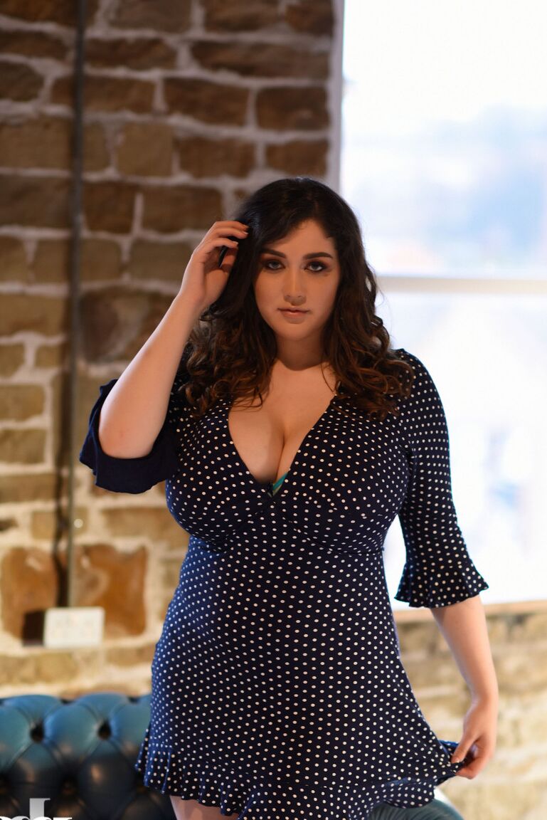 21P Thick brunette Bella B reveals her large melons and poses topless