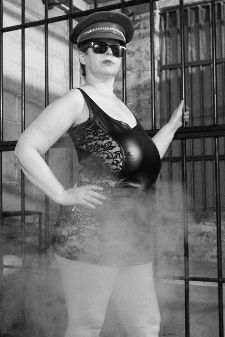 16P British fatty Posh Sophia models fetish wear in and out of a jail cell