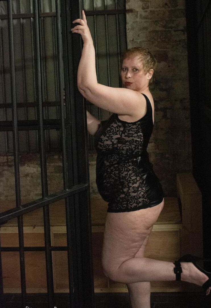 16P British fatty Posh Sophia models fetish wear in and out of a jail cell