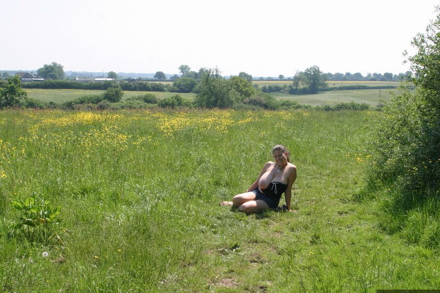 20P Dirty amateur MILF Denise Davies worships her large melons in the field