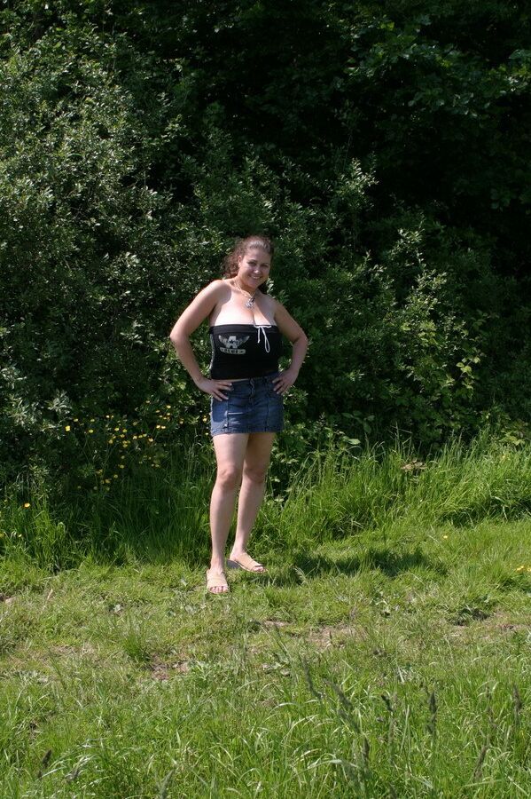 20P Dirty amateur MILF Denise Davies worships her large melons in the field