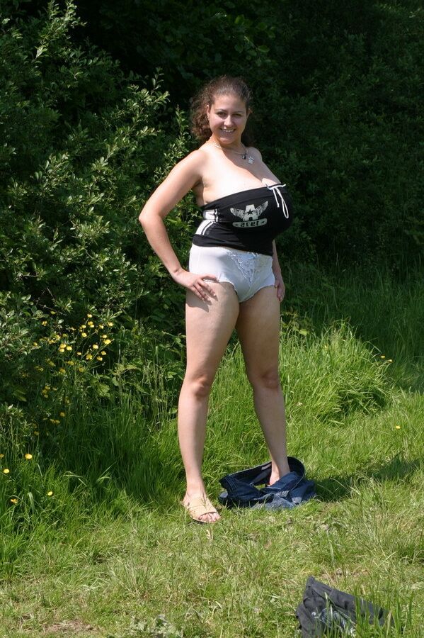 20P Dirty amateur MILF Denise Davies worships her large melons in the field