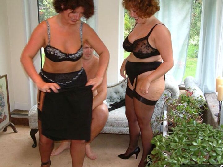 20P UK woman Curvy Claire and a GF strip to their underthings afore a man