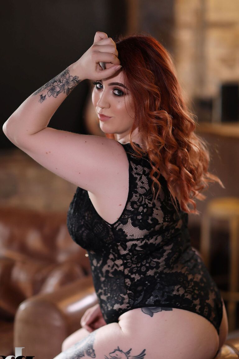 21P Chubby ginger Freyja	strips her lace bodysuit and exposes her juicy breasts