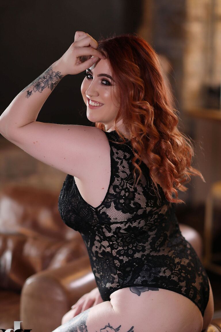 21P Chubby ginger Freyja	strips her lace bodysuit and exposes her juicy breasts