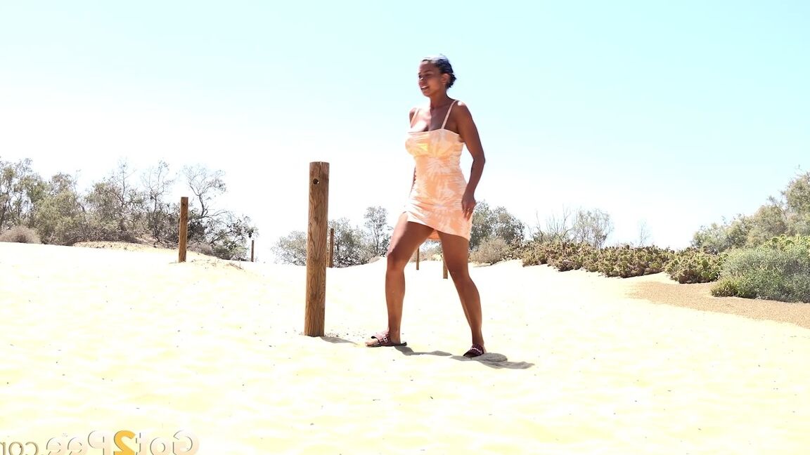 15P Solo girl Chloe Lamour takes a big piss while crossing a patch of sand