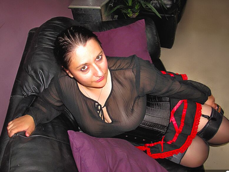 20P Amateur brunette displays her big butt while wearing garters and nylons