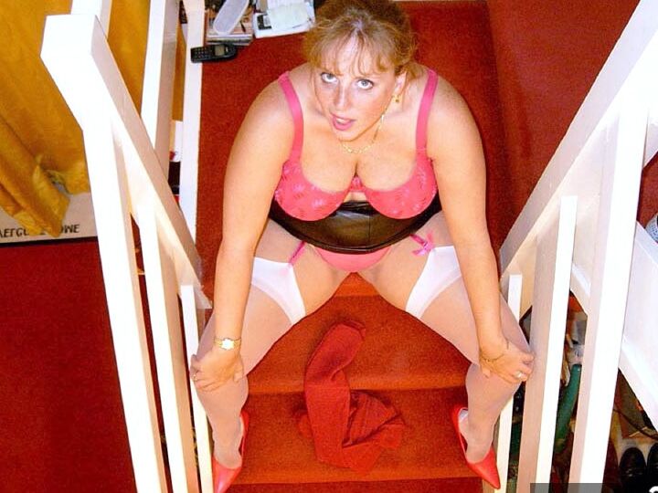 20P UK amateur Curvy Claire drinks wine from a bottle before posing in underthings