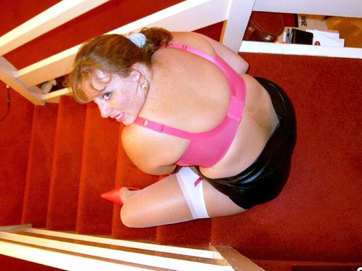 20P UK amateur Curvy Claire drinks wine from a bottle before posing in underthings