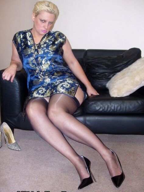 16P Short haired British BBW Daniella English bares her bald cunt in sheer nylons