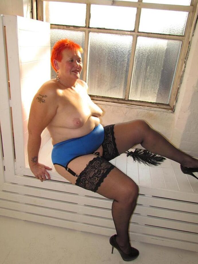 20P Thick redhead Valgasmic Exposed changes garter belts while naked in stockings