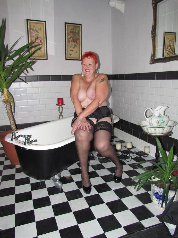 20P Thick redhead Valgasmic Exposed changes garter belts while naked in stockings