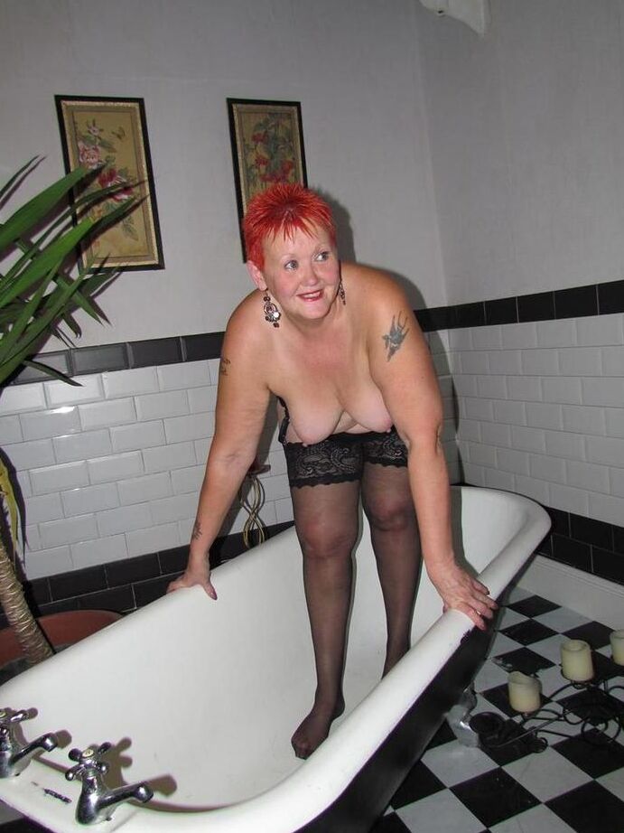 20P Thick redhead Valgasmic Exposed changes garter belts while naked in stockings