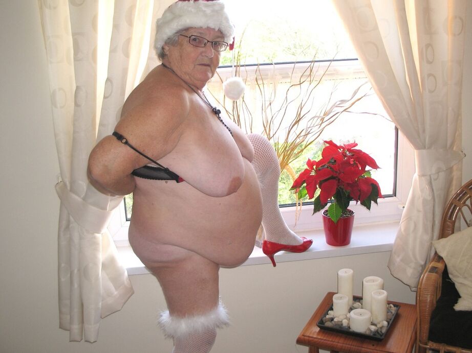 20P British nan Grandma Libby exposes her fat body in a Christmas hat and hosiery