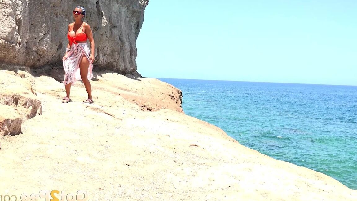 15P Caucasian girl Chloe Lamour takes a piss while walking upon a seaside cliff
