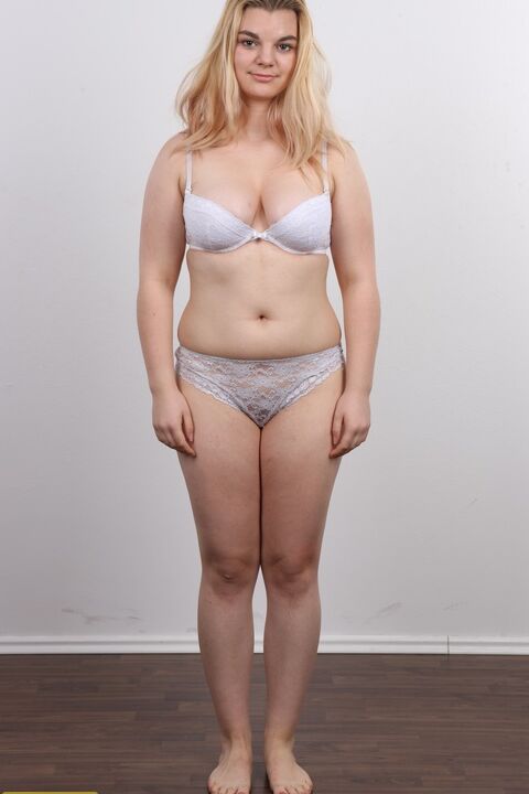 12P Chunky blonde girl Aneta stands fully clothed and then as naked as one can get