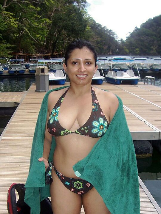 15P Plump Indian chick shows her big naturals in and out of clothes