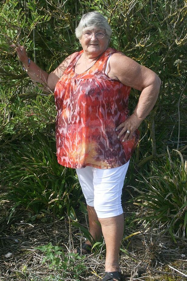 20P Obese nan Grandma Libby strips totally naked out by evergreen trees