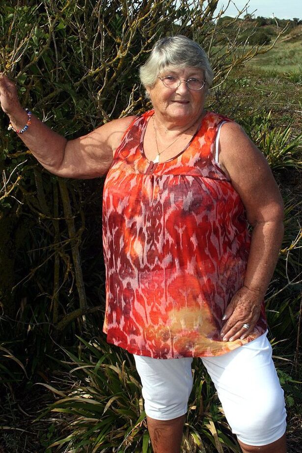 20P Obese nan Grandma Libby strips totally naked out by evergreen trees