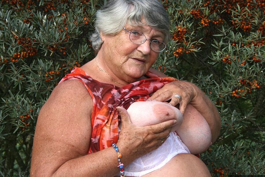 20P Obese nan Grandma Libby strips totally naked out by evergreen trees