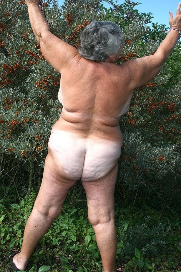 20P Obese nan Grandma Libby strips totally naked out by evergreen trees