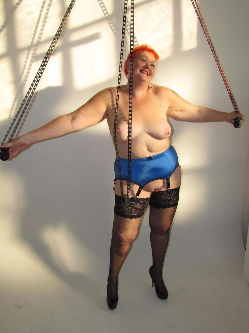 20P Older redhead Valgasmic Exposed steps into a bathtub while wearing stockings