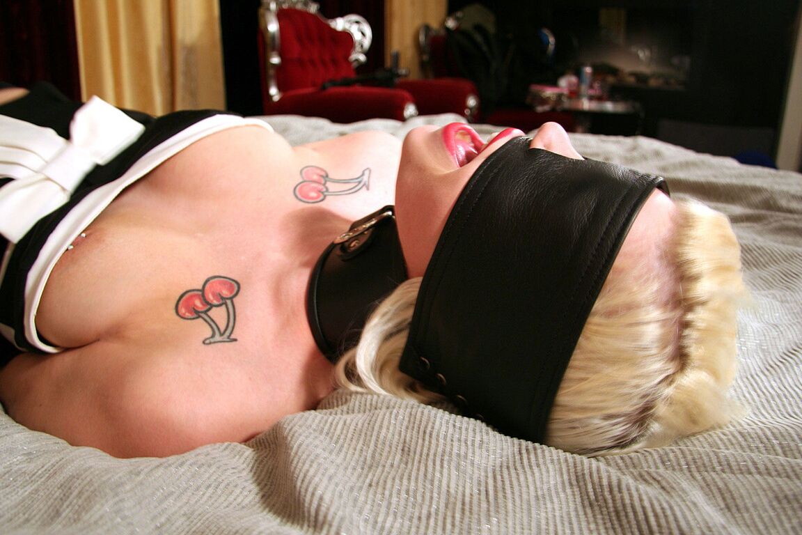 16P Collared and restrained blonde Dizzy Duveaux finds herself blindfolded too