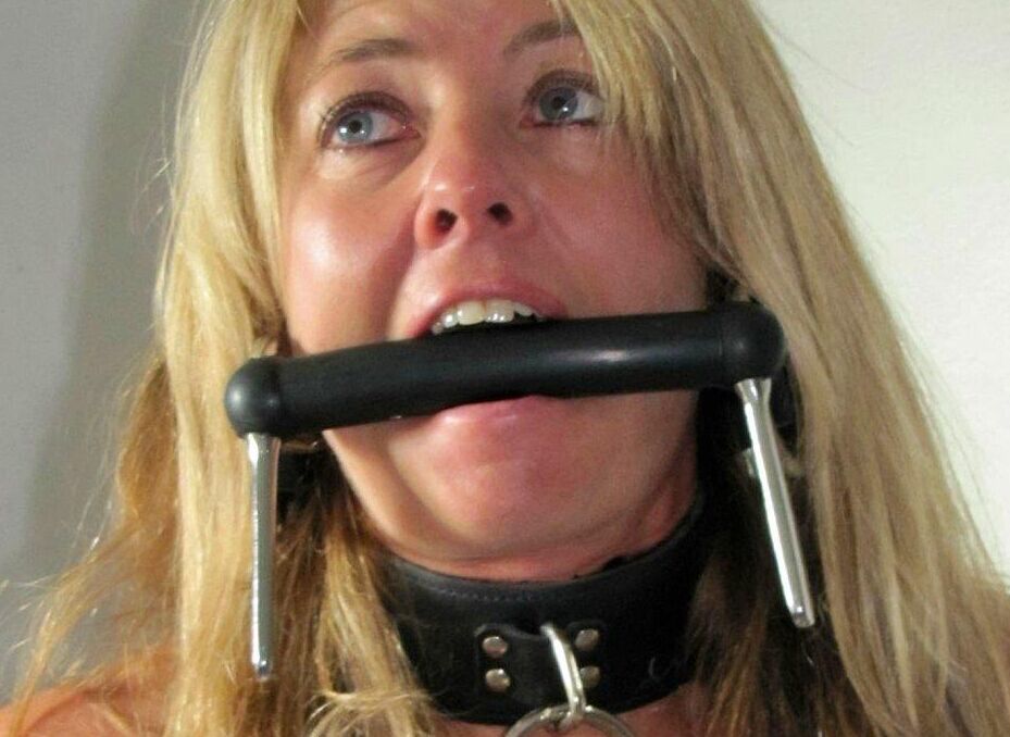 14P Blonde woman is gagged while her ankles and wrists are bound with rope
