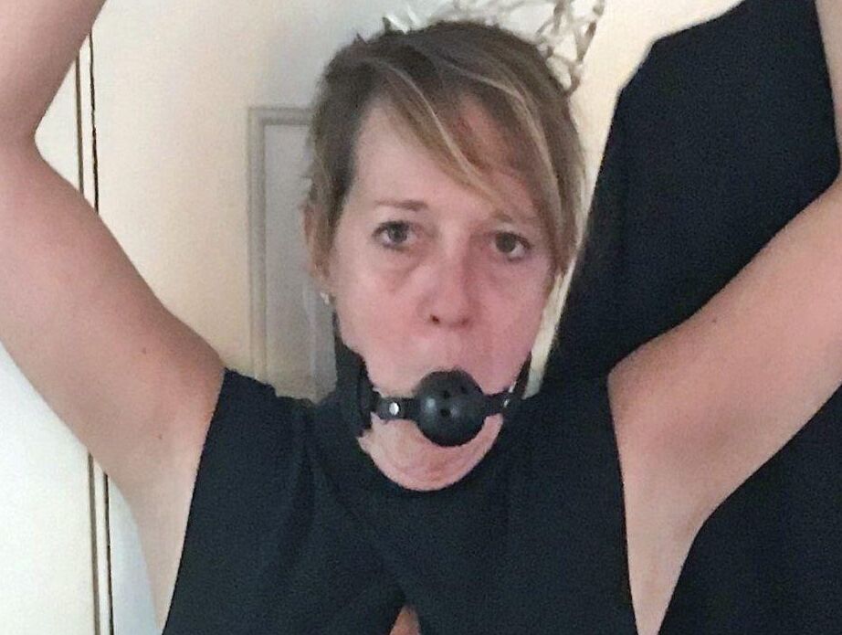 16P Mature lady Meyer is fitted with a ball gag and nipple clamps while restrained