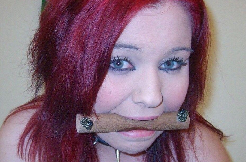 16P Busty redhead sports a gag and nipple clamps while wrist and ankle bound