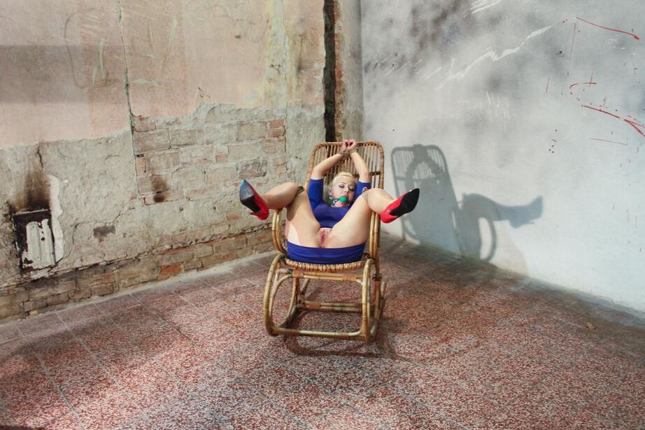 16P Punky blonde in rope restraints and a ball gag endures a forced masturbation