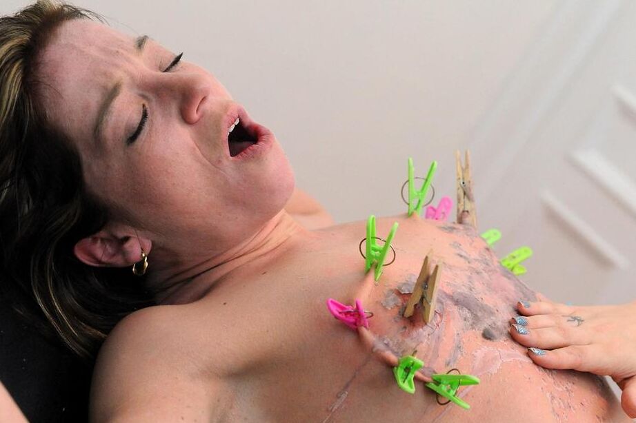 16P Blond chick in a nurse's cap and lingerie tortures a woman with wax and clamps
