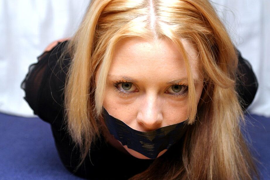 12P Natural blonde with blue eyes is left duct taped and hog tied in clothing