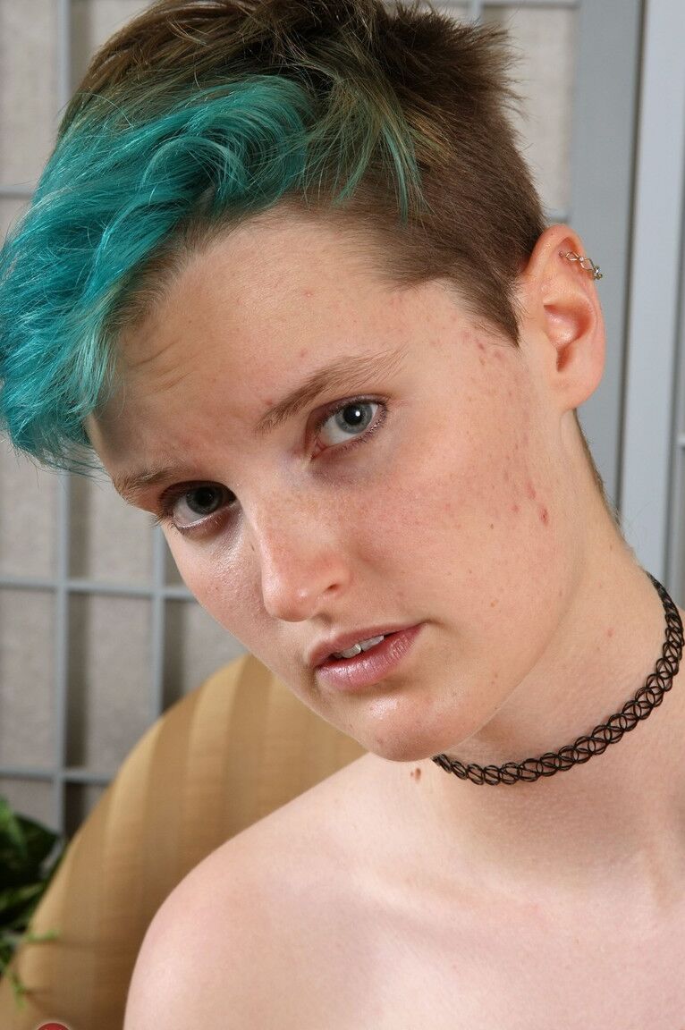 21P Short haired babe Cyan undresses and teases with her hairy pussy