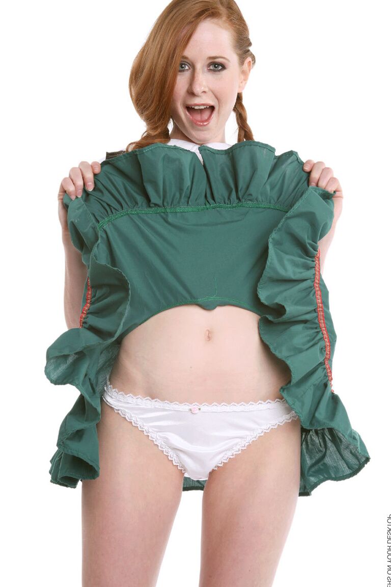 15P Redhead chick Lucie T strips off her uniform in over the knee nylons