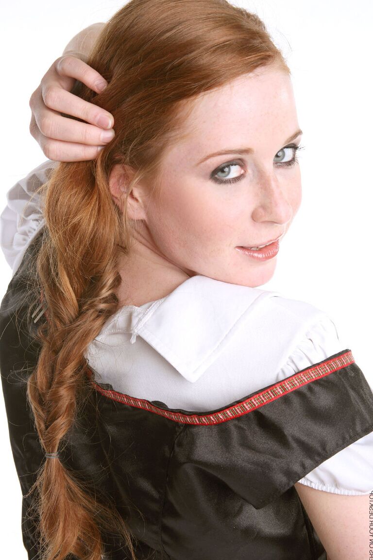15P Redhead chick Lucie T strips off her uniform in over the knee nylons