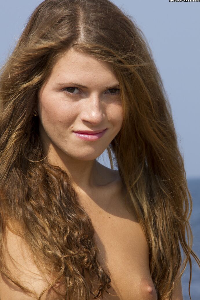20P Teen first timer gets totally naked on rocky shoreline in solo action