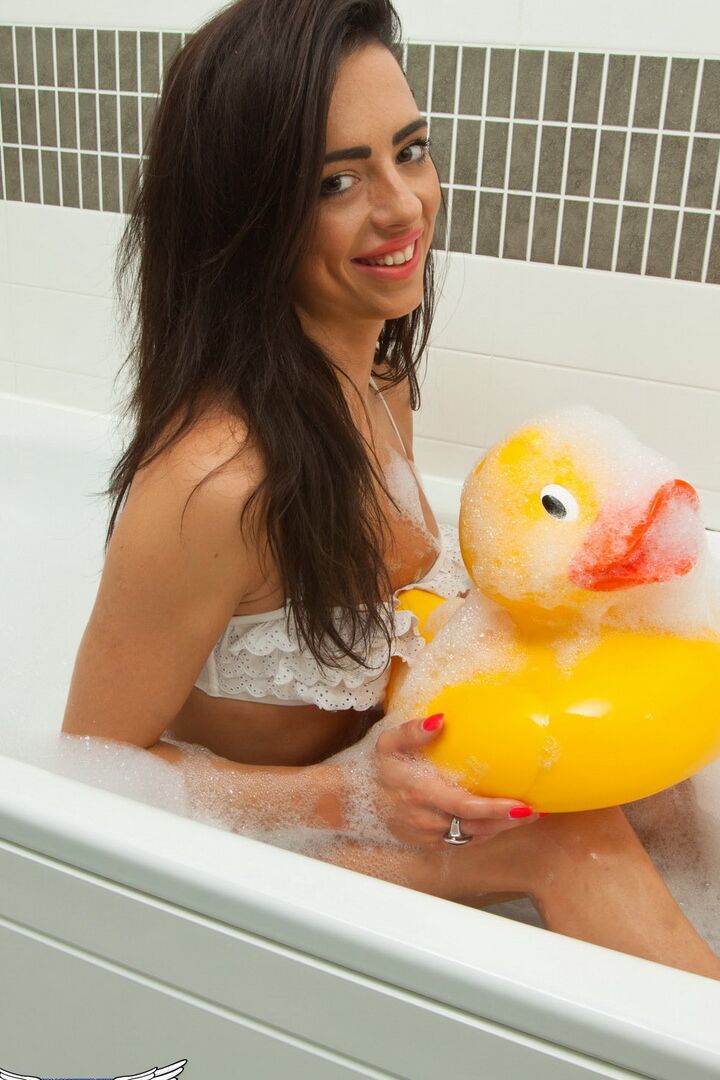 12P Horny tease Sofia Cortez plays with her giant ducky in the tub as she strips