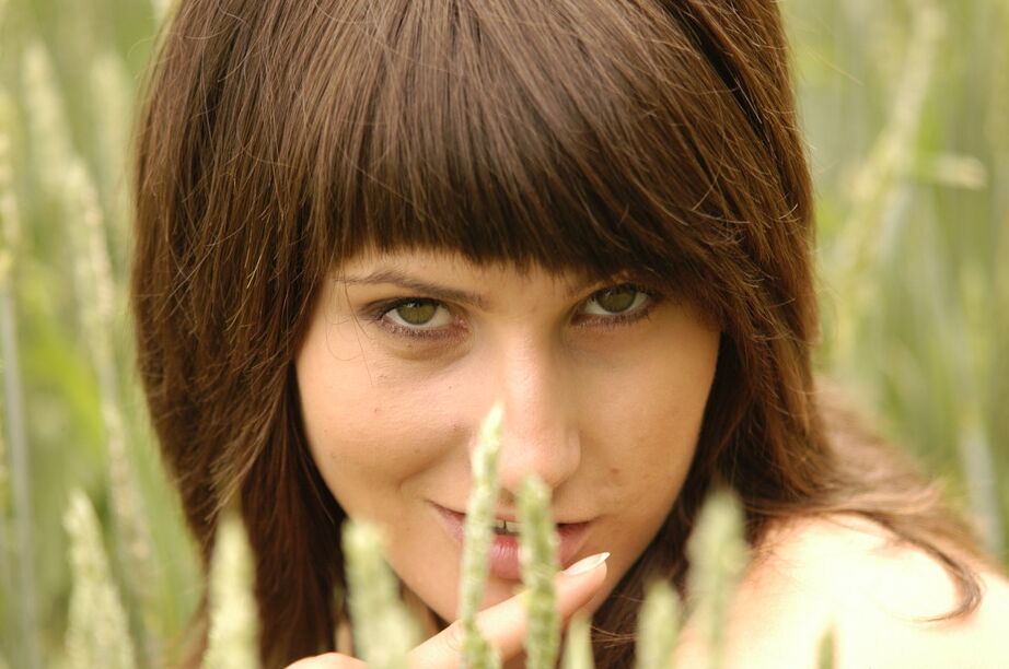 16P European teen Rita F uncovers her small tits while undressing in a hay field